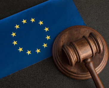 Judge gavel and European Union flag. Jurisprudence in Europe. Legality concept.